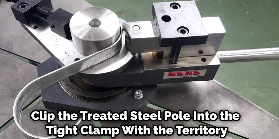 Clip the Treated Steel Pole Into the Tight Clamp With the Territory