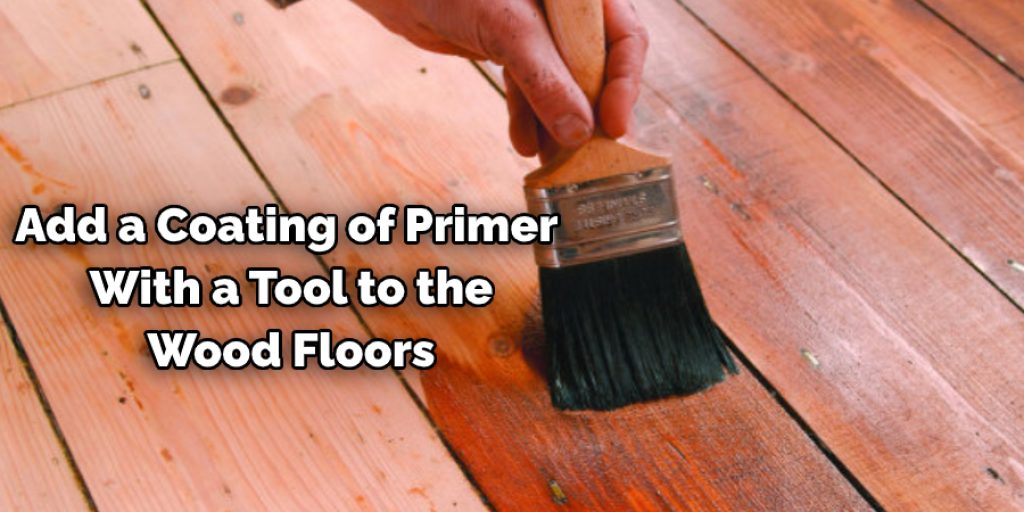 Add a Coating of Primer  With a Tool to the Wood Floors