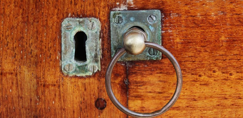 how to fix a door knob hole that is too big