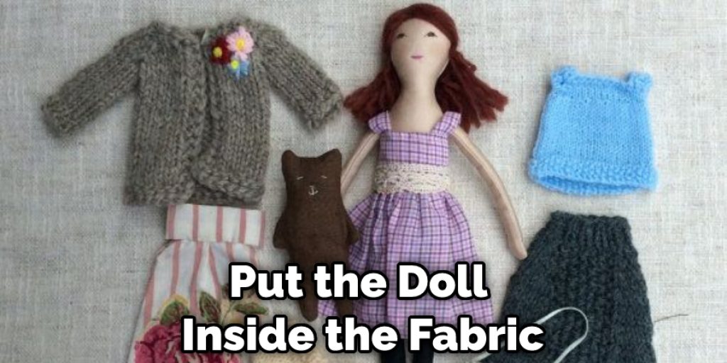 Put the Doll Inside the Fabric