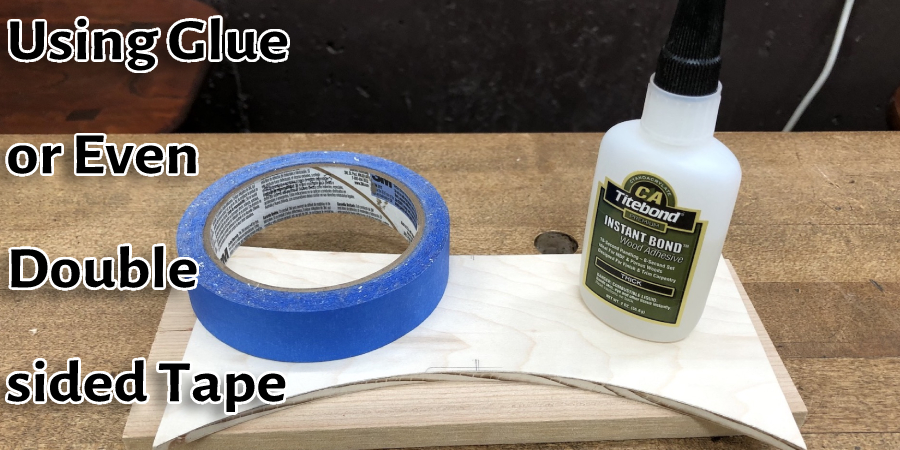 Using glue or even double-sided tape 