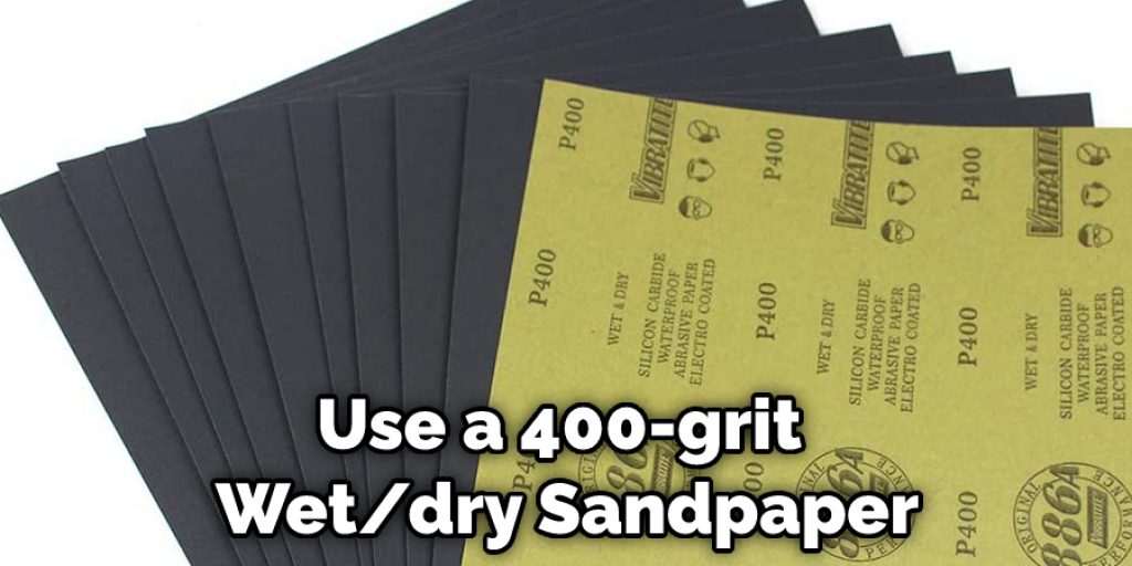 Use a 400-grit Wet/dry Sandpaper