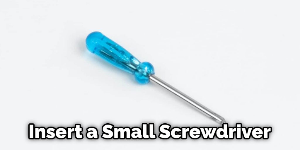 Insert a Small Screwdriver