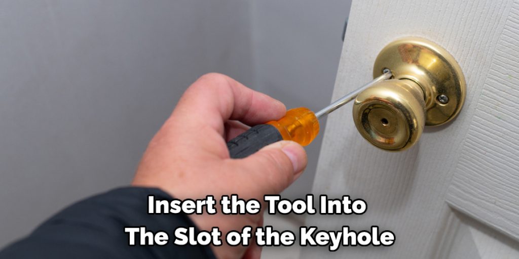 Insert the Tool Into  The Slot of the Keyhole