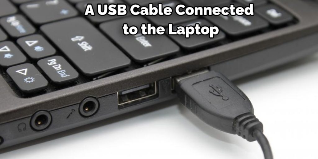A USB Cable Connected  to the Laptop