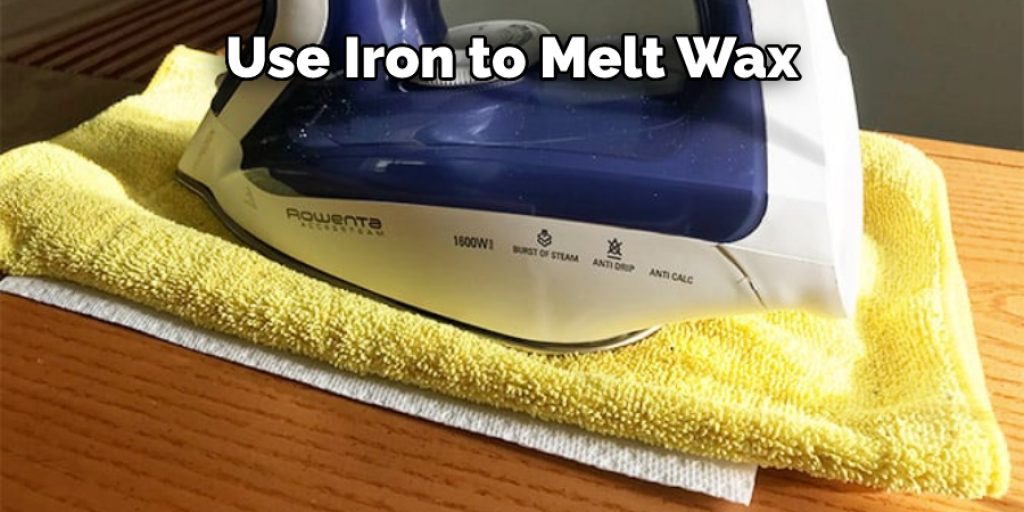 Use Iron to Melt Wax