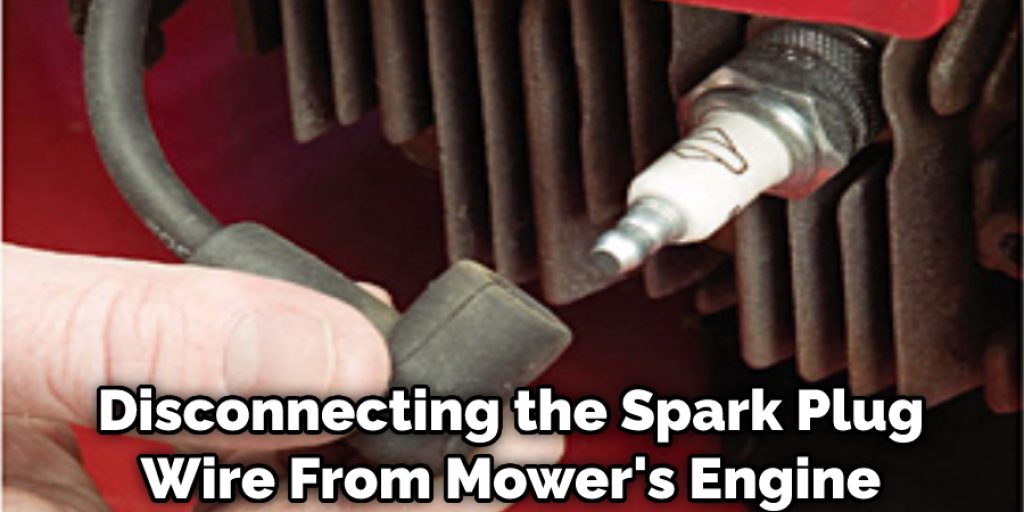 Disconnecting the Spark Plug Wire From Mower's Engine