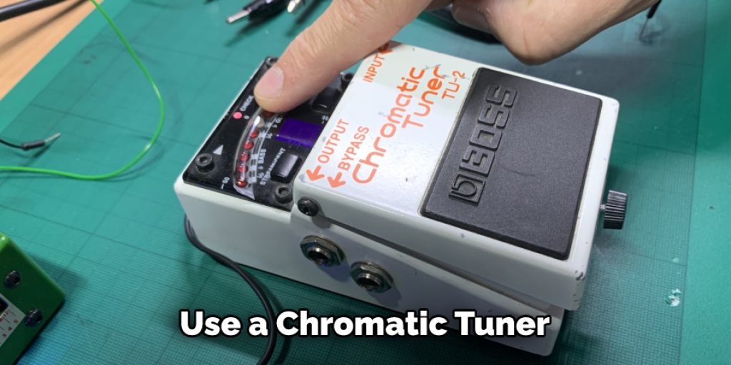 Use a Chromatic Tuner