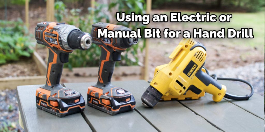 using an electric or manual bit for a hand drill.