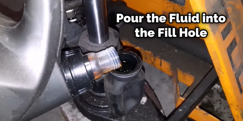 Pour the Fluid into the Fill Hole