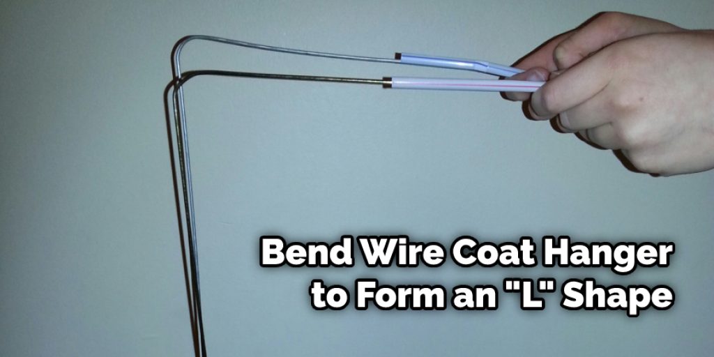 Bend Wire Coat Hanger to Form an "L" Shape