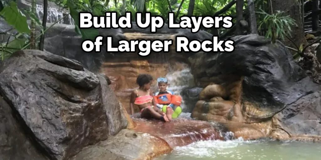 Build Up Layers of Larger Rocks