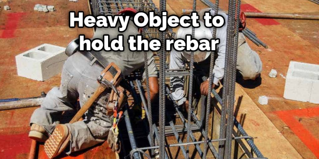 Heavy Object to hold the rebar