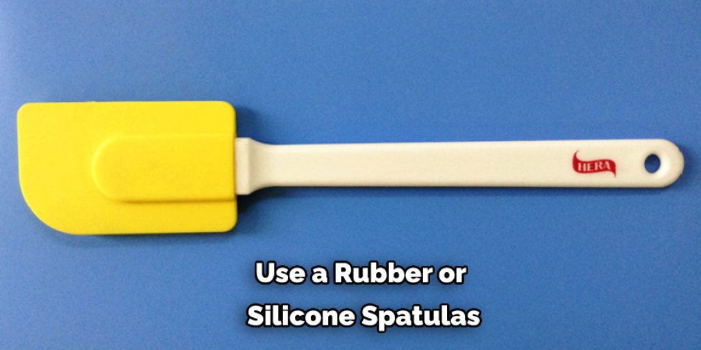 Use a Rubber or  Silicone Spatulas