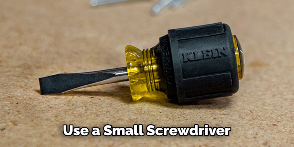 Use a Small Screwdriver