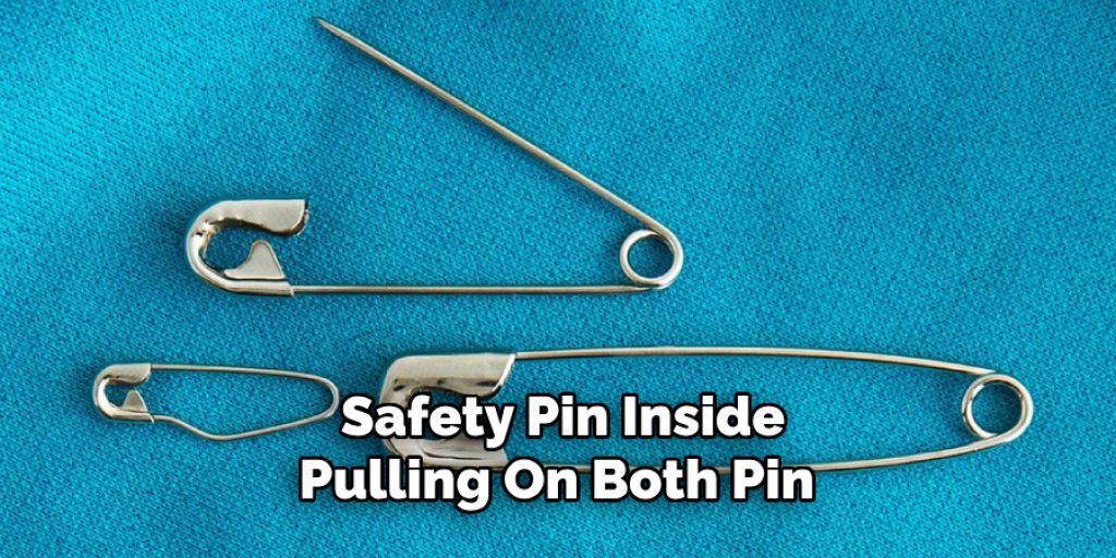 Safety Pin Inside
Pulling On Both Pin 