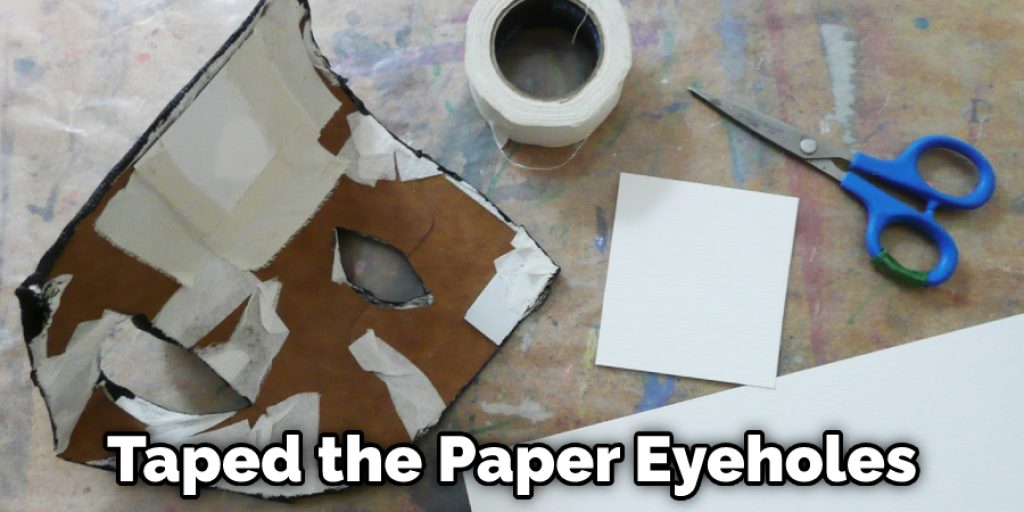 Taped the Paper Eyeholes