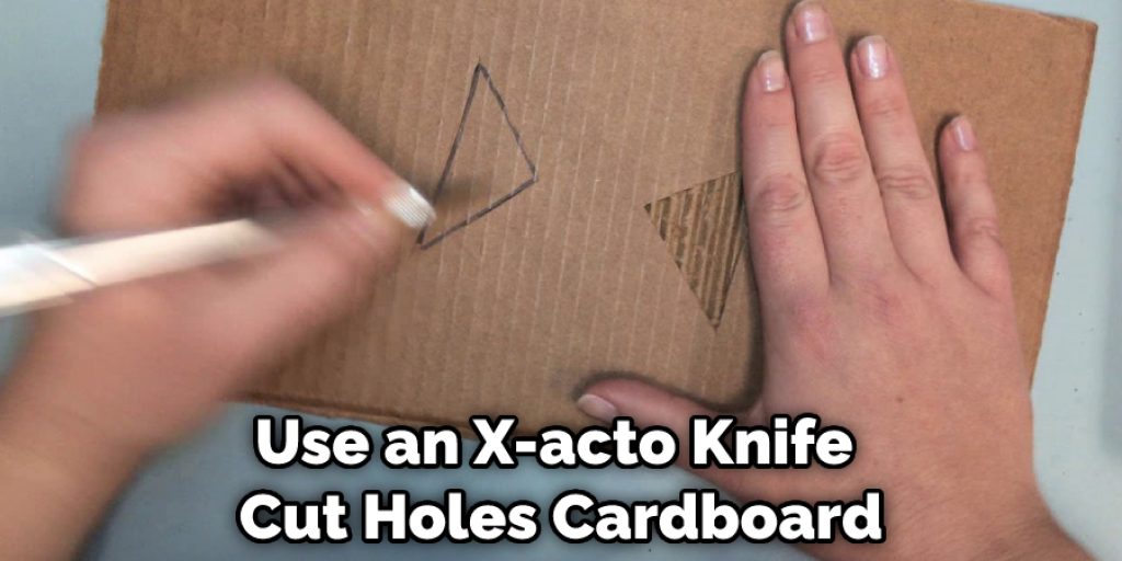 Use an X-acto Knife  Cut Holes Cardboard