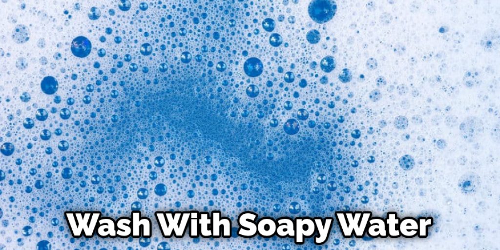 Wash With Soapy Water