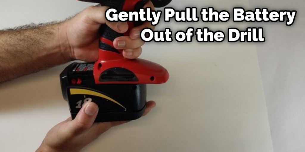 Gently Pull the Battery Out of the Drill