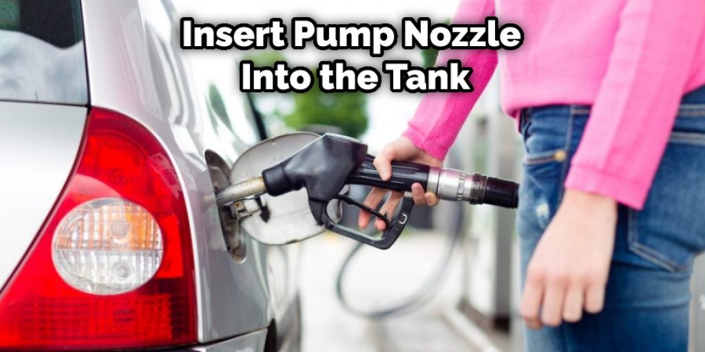 Insert Pump Nozzle  Into the Tank