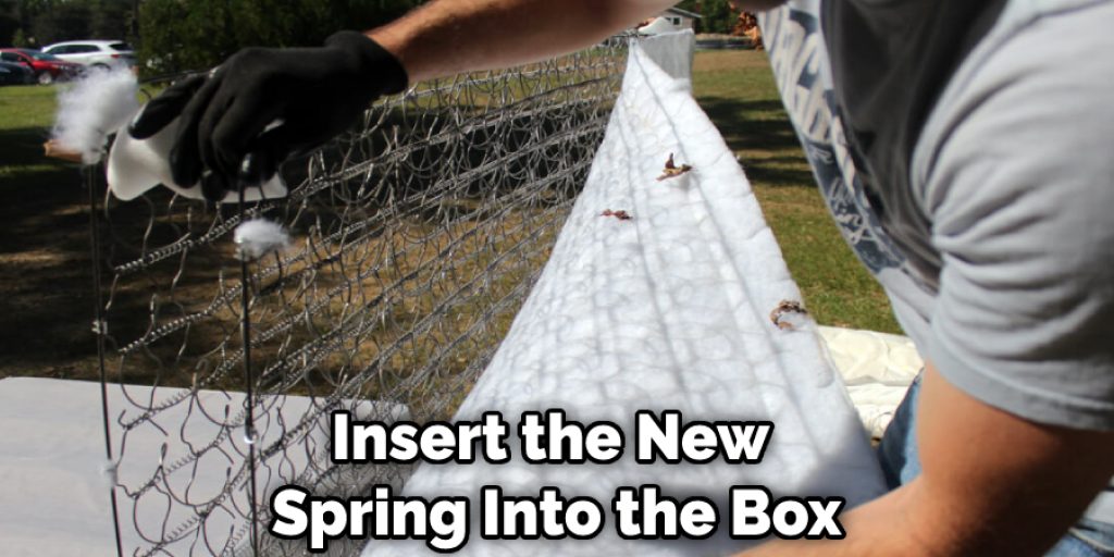 Insert the New Spring Into the Box