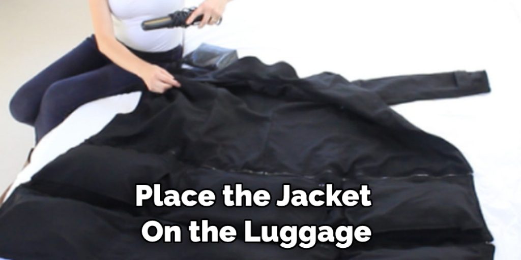 Place the Jacket  On the Luggage