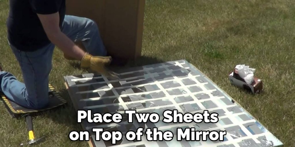 Place Two Sheets on Top of the Mirror