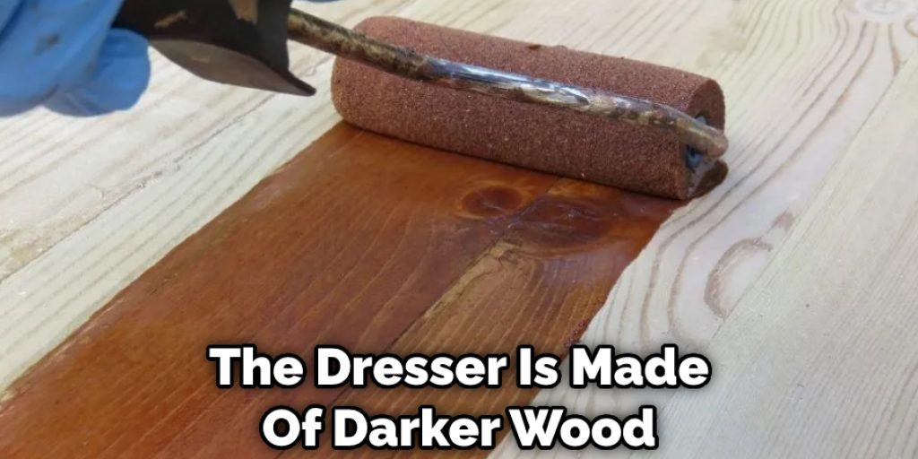 The Dresser Is Made Of Darker Wood