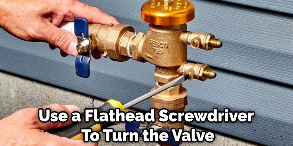 Use-a-Flathead-Screwdriver-To-Turn-the-Valve