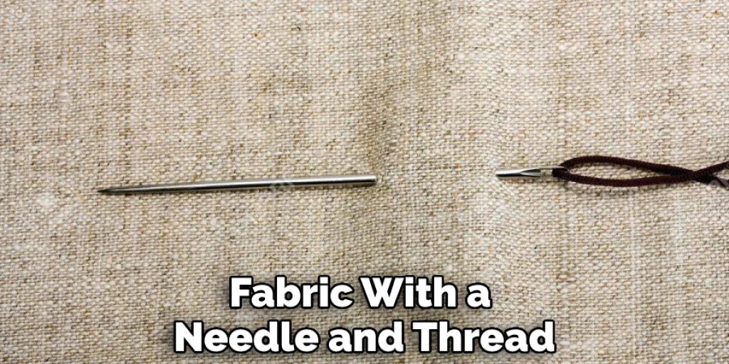 Fabric With a Needle and Thread