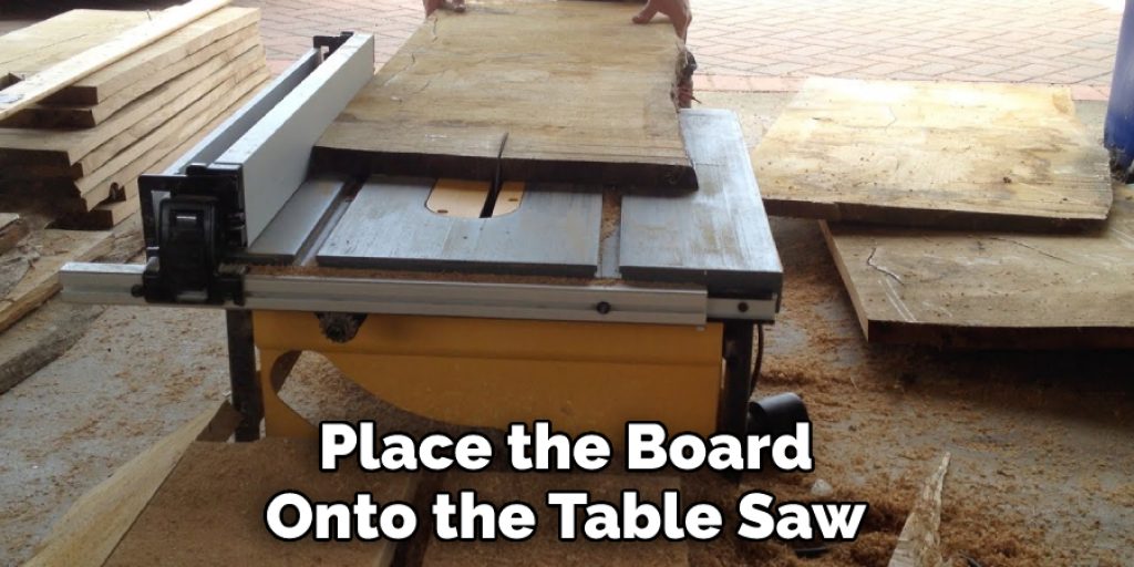 Place the Board Onto the Table Saw
