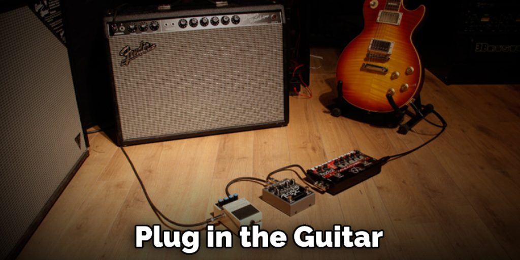 Plug in the Guitar