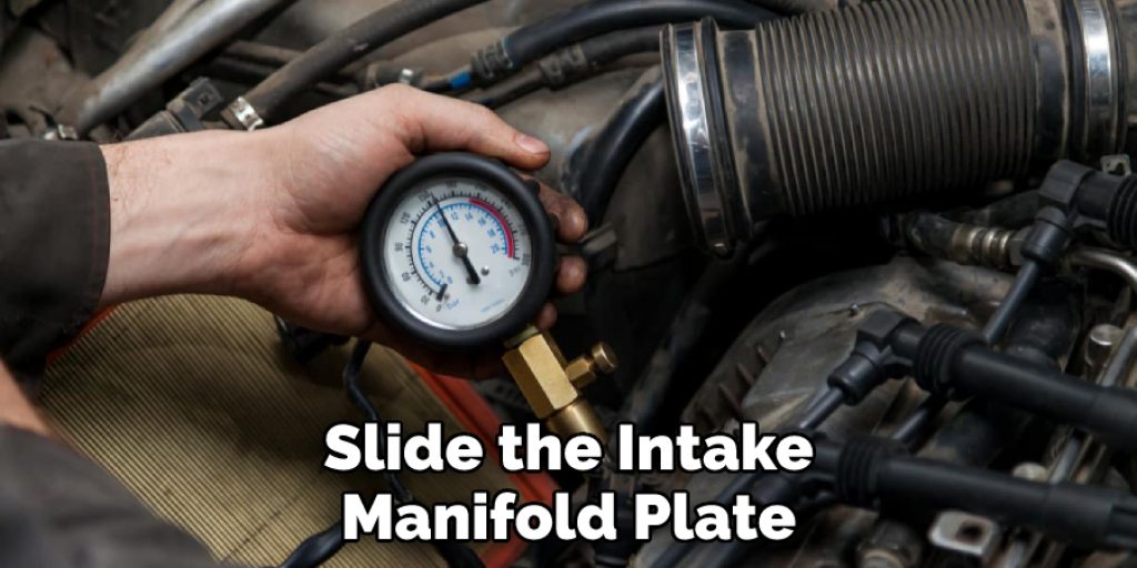 Slide the Intake Manifold Plate