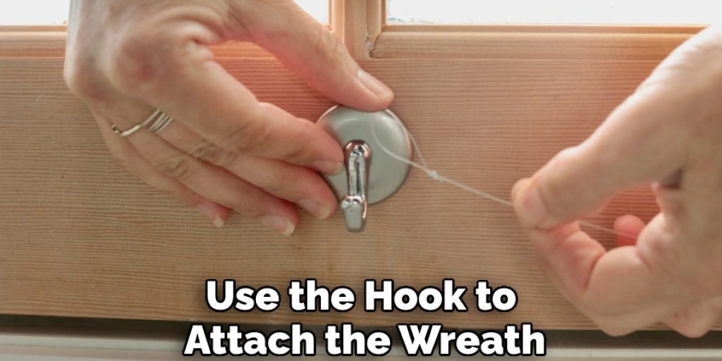 Use the Hook to Attach the Wreath