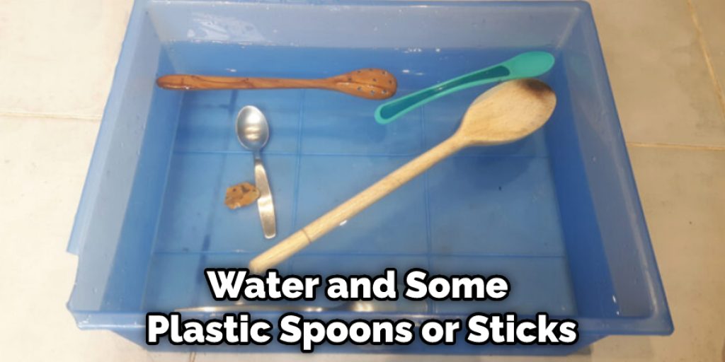 Water and Some Plastic Spoons or Sticks
