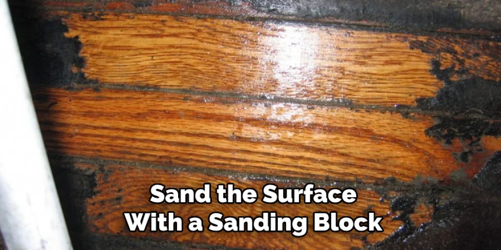 Sand the Surface With a Sanding Block