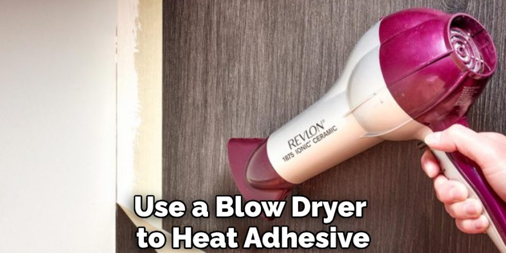 Use a Blow Dryer to Heat Adhesive