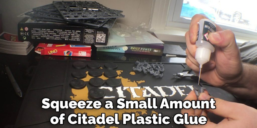 Squeeze a Small Amount of Citadel Plastic Glue