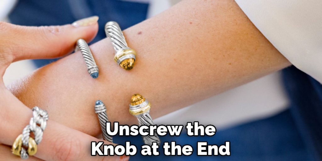 Unscrew the Knob at the End