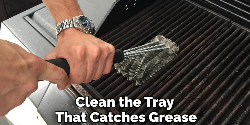Clean the Tray That Catches Grease