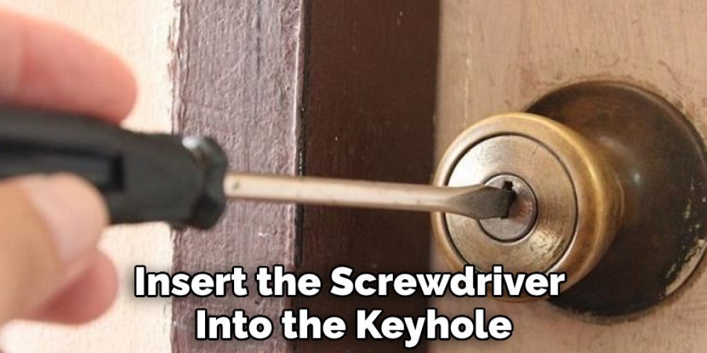 Insert the Screwdriver Into the Keyhole