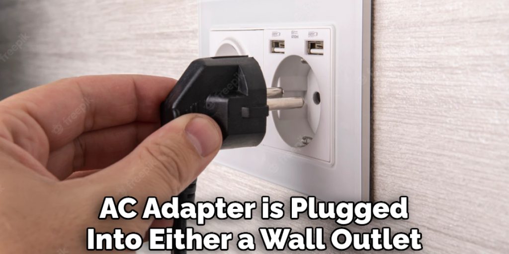 AC Adapter is Plugged Into Either a Wall Outlet