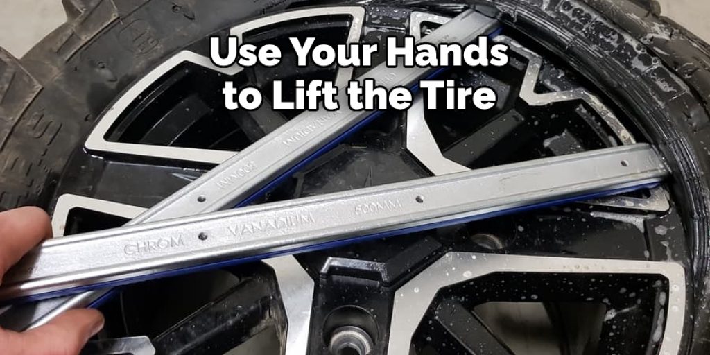 Use Your Hands  to Lift the Tire