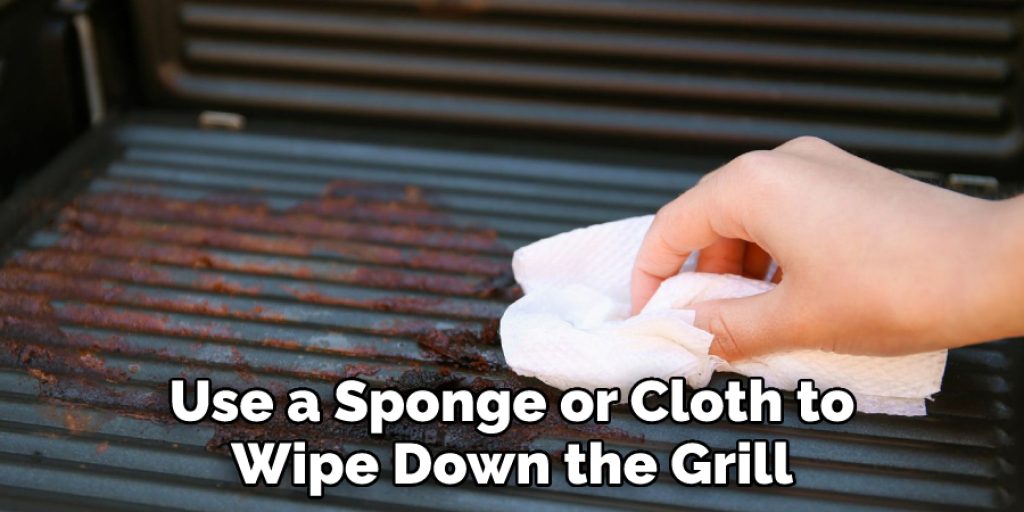 Use a Sponge or Cloth to  Wipe Down the Grill