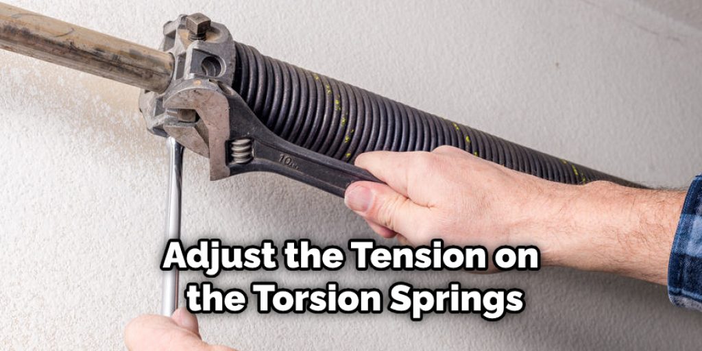 Adjust the Tension on the Torsion Springs