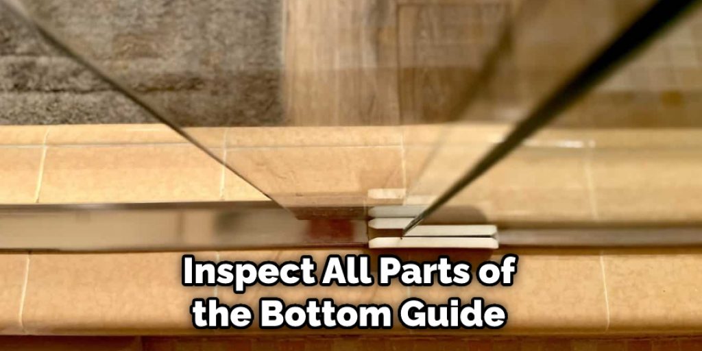  Inspect All Parts of the Bottom Guide