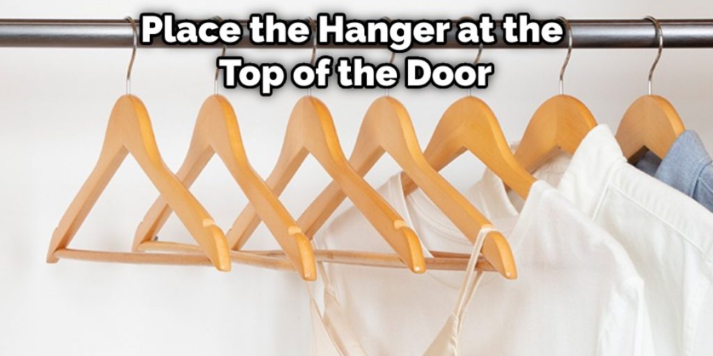 Place the Hanger at the Top of the Door