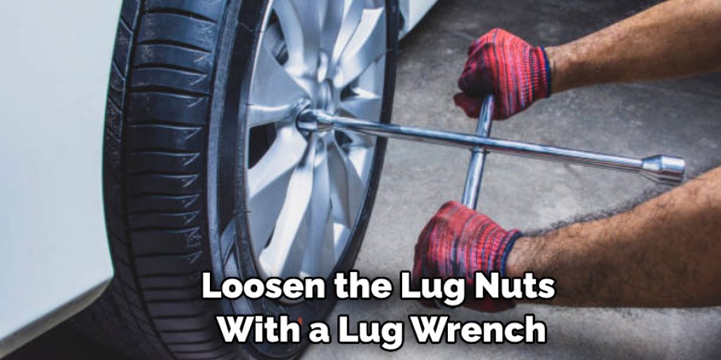 Loosen the Lug Nuts With a Lug Wrench