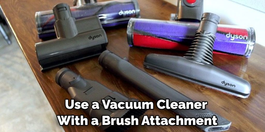 Use a Vacuum Cleaner With a Brush Attachment